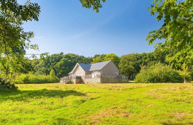 A delightful lodge with hot tub on Wakes Hall Farm is a haven of peace in 500 acres of private land