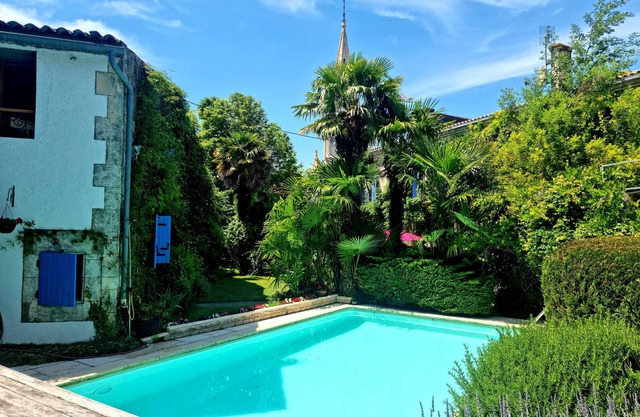 A pretty cottage with pool and lovely garden in a village close to sea .