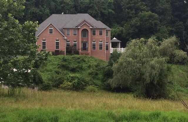 A Unique & Private Single Family Home with 5 acres of privacy.