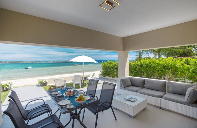 Amazing villa right on the beach feet in the water