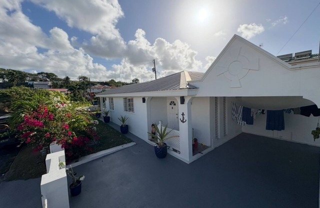 Anchor Villa , 4 bedroom single family home nSteps to the beach .