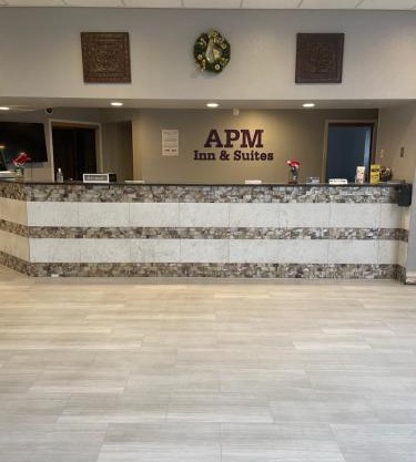 Apm Inn & Suites