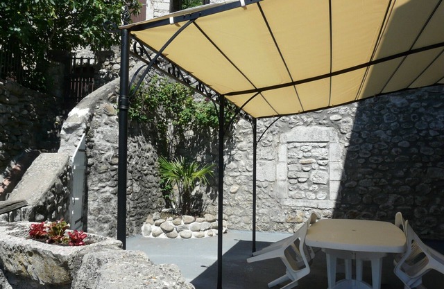 Appt in listed village on river bank, with terrace and barbecue