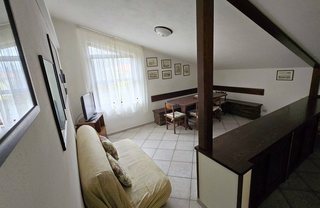 Attic family apartment surrounded by nature, 2 minutes from the sea.