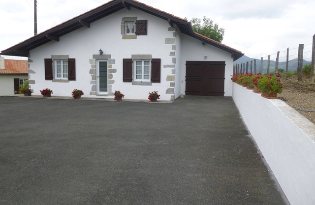 Basque house located between sea and mountains.