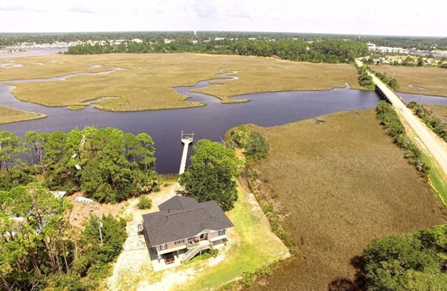 Bayou Breeze is a waterfront house on a private one-acre lot