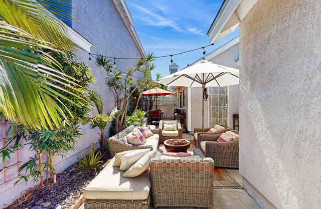 Beach Getaway with Furnished Patio & Full Kitchen + Shared Pool & Spa