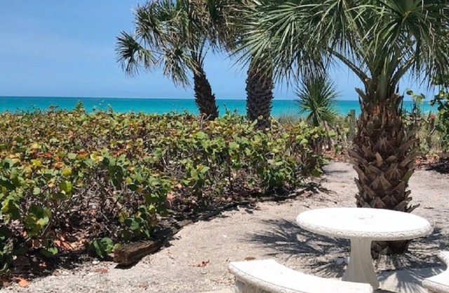 Beach, Sand, Sunsets. . . Rocking chair in front of the porch!
