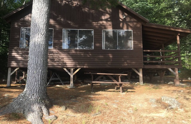Beachfront Cottage on Ambajejus Lake With Sandy Beach and a Mountain View