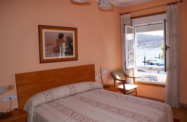 Beachfront villa with private garden and patio and free parking on the street.