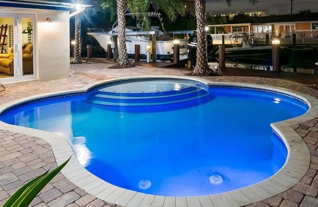 Beachy Tiki Waterfront Home w/Boat Rental or Dock Your Own Boat~Free Kayaks~Heated Pool~Sunrise Yoga