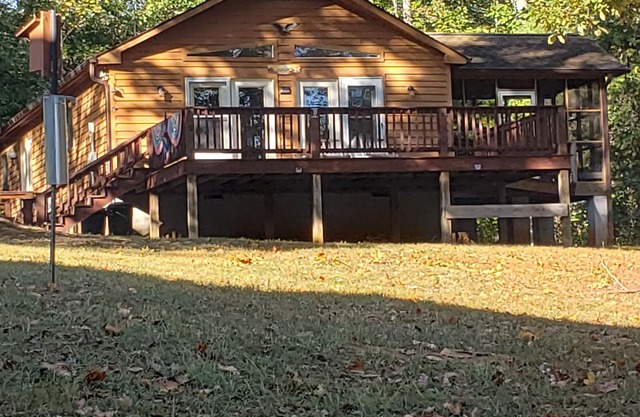Beautiful Lake Cottage with water access, private dock in cove and fire pit