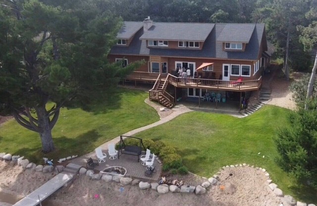 Beautiful lake home on the sandy south shores of Pelican Lake.
