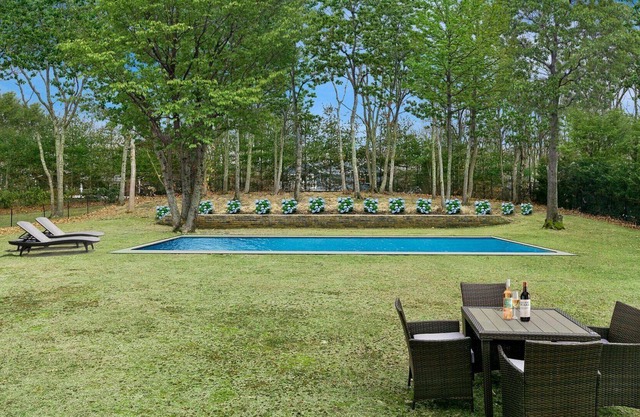 Beautiful Peconic Bay home with water views, private pool, wraparound front...