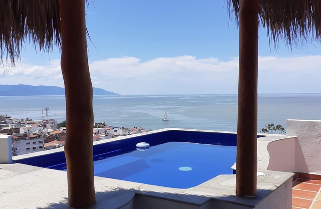 Beautiful view from penthouse suite. Pool, terrace, bar.