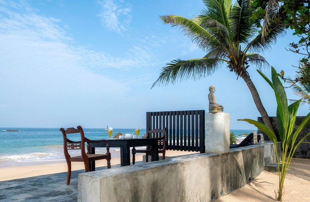 Blue Parrot Beach Villa Righ on the white sand beach,