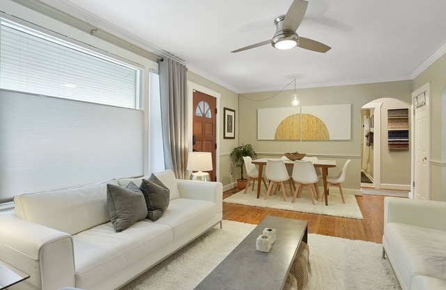 Boutique style home with original works of art on a gorgeous tree lined street.