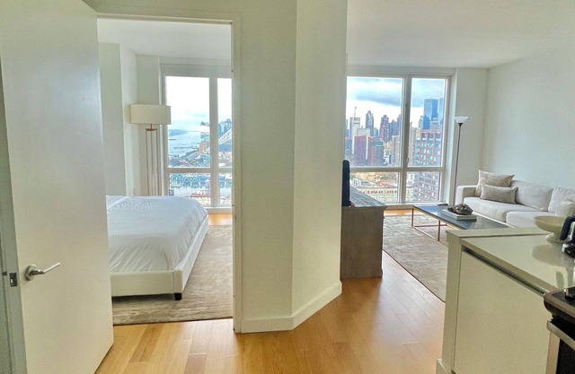 BREATHTAKING SKYLINE VIEWS! Lux 1 Bedroom Suite in best location by Times Sq
