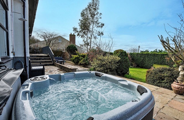 Bungalow in Dyserth with Hot Tub & Waterfall