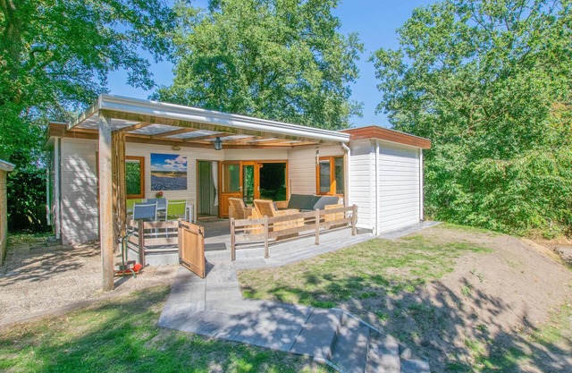 Chalet in the woods with veranda and sauna