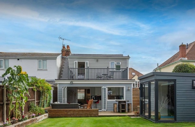 Chalet style home with large garden and beach hut within 2 minute walk