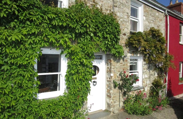 Character cottage in heart of village with stunning estuary view and garden
