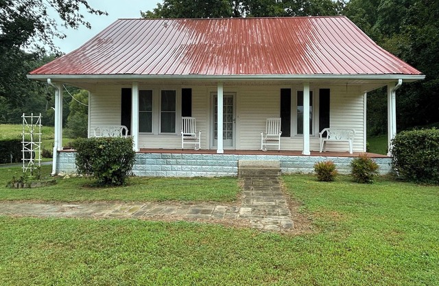 Charming 3-bedroom farmhouse with 2 full baths in a quiet country setting.