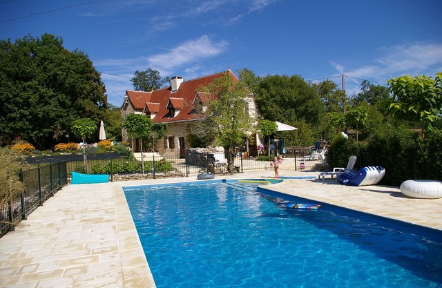 Charming air-conditioned house with heated fenced swimming pool and large garden
