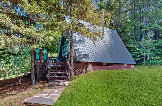 Charming gingerbread A-frame situated on 3 acres, woodstove, A/C, deck