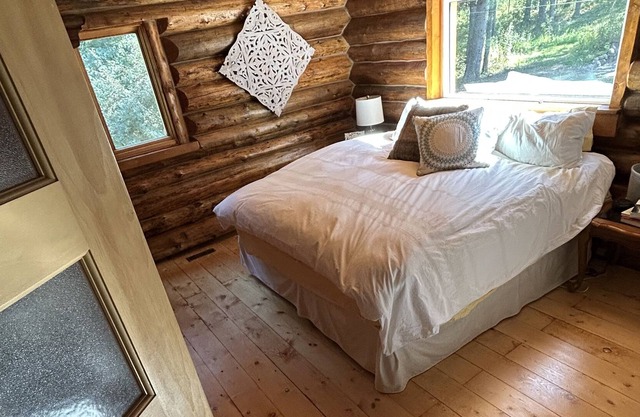 Charming Log Home Nestled in 7 Wooded Acres