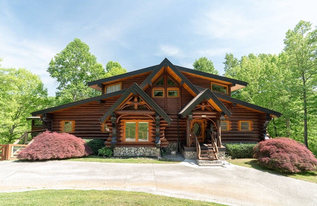 Charming log home with stunning lakefront views, hot tub, boat rental available