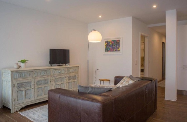 Chestnut apartment surrounded by greenery