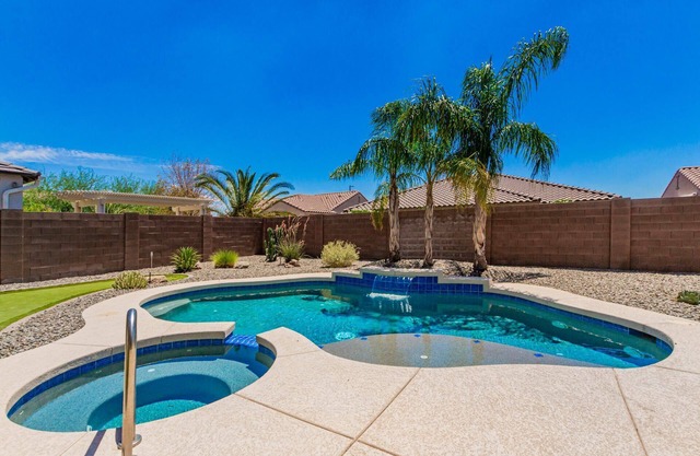 Chill by the pool in this Estrella Mtn Ranch designers home!