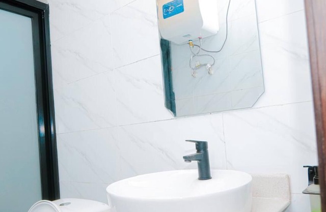Comfy hotel suites in vibrant Kinshasa with WiFi, AC