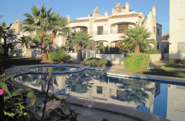 condo in cozy garden beside the pool.