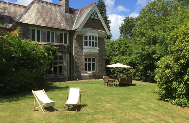 Country House With Bluebell Wood In Dartmoor National Park