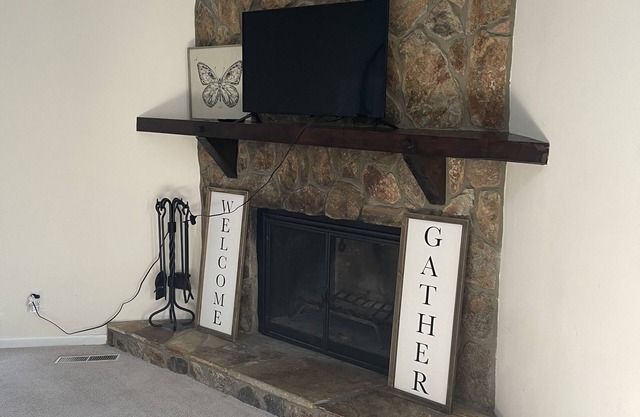 Cozy 4 bedroom with spiral staircase and fireplace