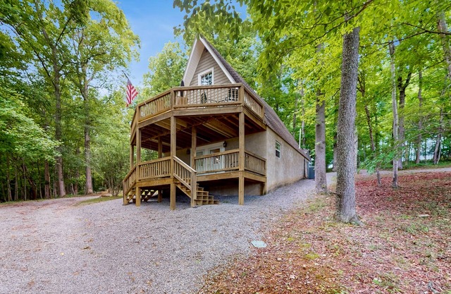 Cozy A-frame home with fire pit, deck, pickleball court, and covered boat slip