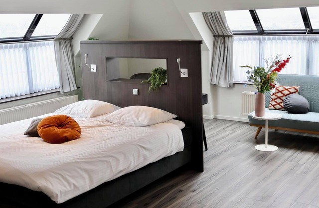 Deluxe hotel room with luxurious amenities, a duo whirlpool tub, and stunning water views for the ultimate relaxation.
