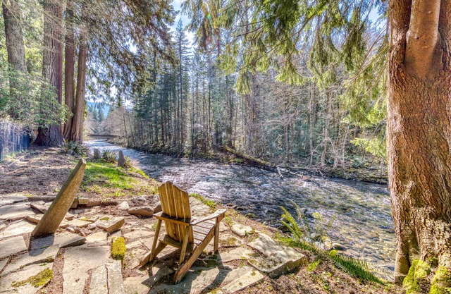 Dog-friendly, riverfront home w/a wood-burning fireplace & views