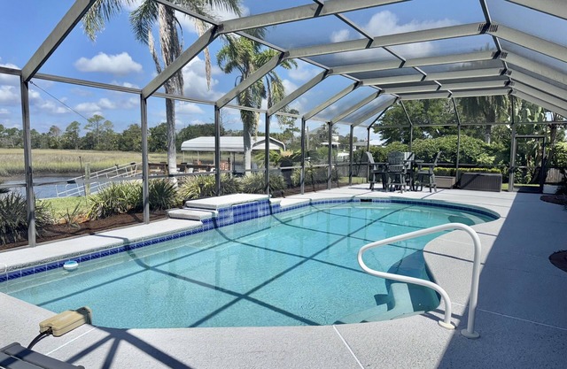 Dog-friendly waterfront home with private dock, boat lift, pool and spa