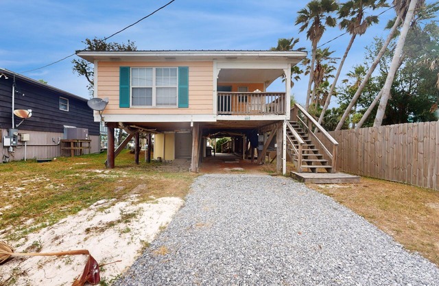 Dog-friendly waterfront retreat with a washer/dryer, AC, patio, & outdoor shower