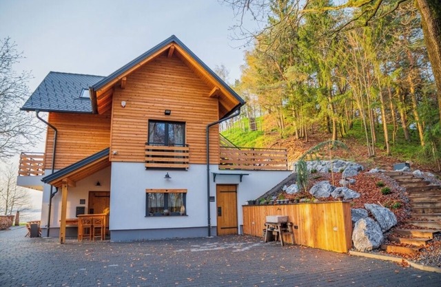 Double bedroom with balcony and idyllic view surrounded by nature