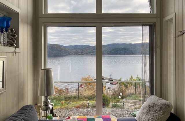 Enjoy a unique panoramic view in this inviting vacation home on the lake.