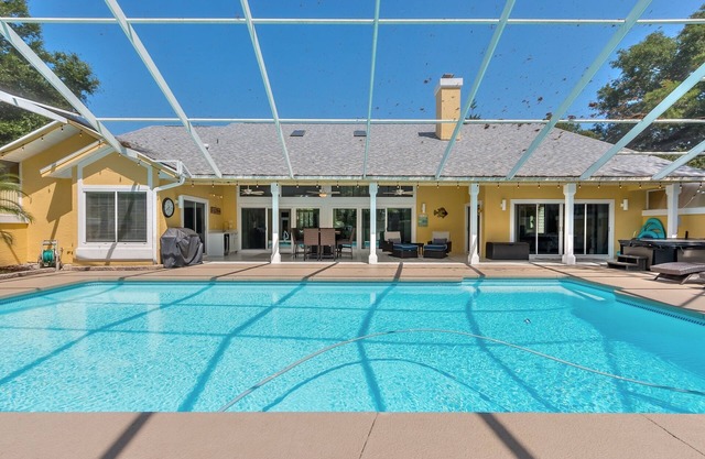 Executive 3-Bedroom Hangar Home within Spruce Creek Fly-In, live 24 hr security.