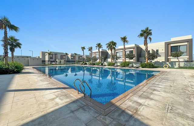 Family 4BR Villa with a Shared Pool, Gym & Private Garden