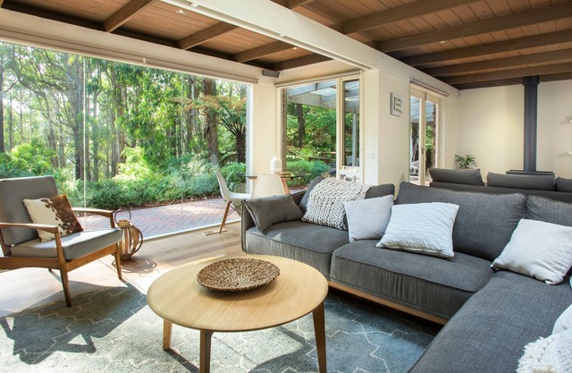 Fernview On Falls - This three-bedroom house is filled with light and surrounded by tall trees, and native gardens.