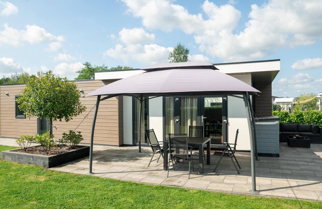 Fine chalet with a garden in a small park