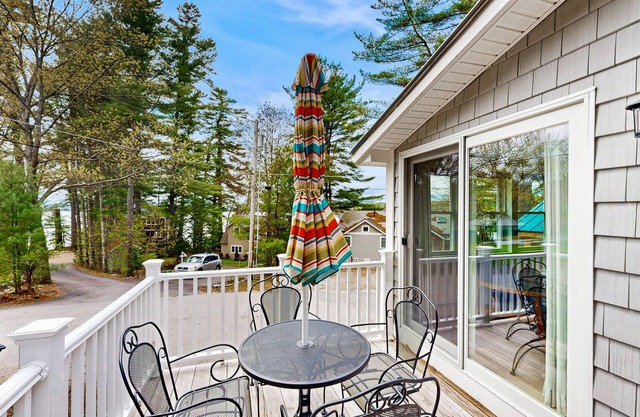Fully renovated home with lake view, dock & mooring access, kayaks, & deck