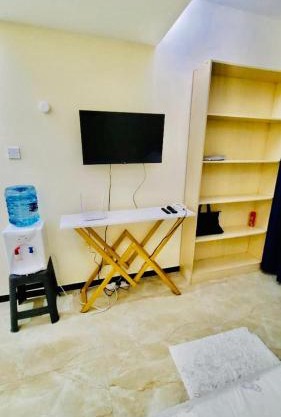 furnished two bedroom apartment with swimming pool, fully equipped gym, private parking space ,children playground and unbeatable scenic city views in kilimani